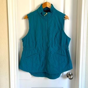 Turquoise colored fleece lined vest